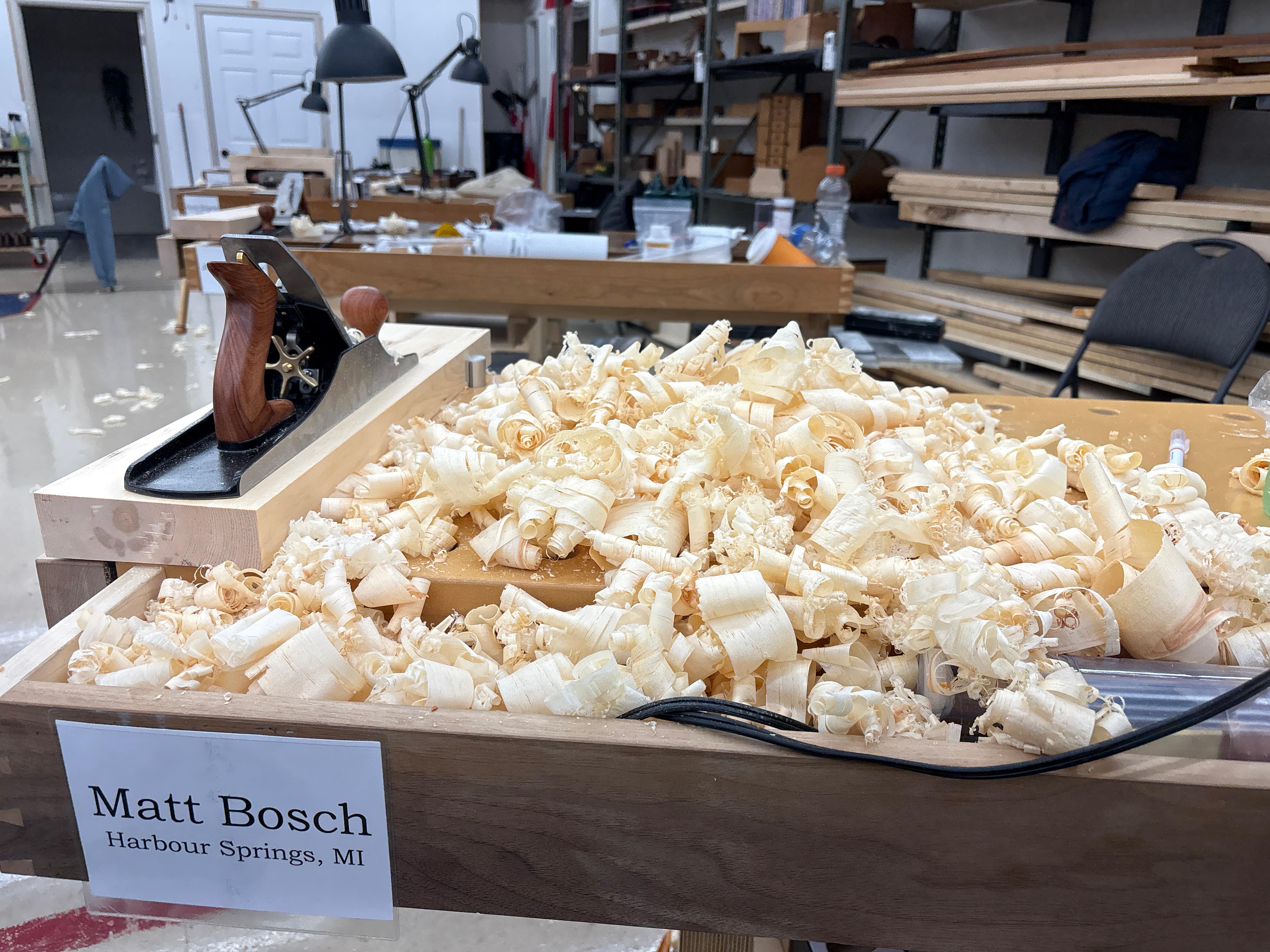 Wooden box filled with popcorn in a workshop setting