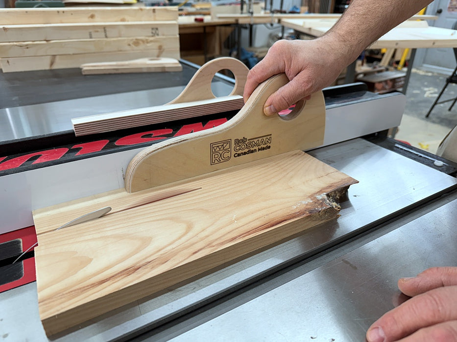 Woodworking tool being used on a table saw in a workshop setting