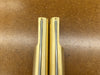 Two Rob Cosman Brass 1-inch benchdogs showing the primary and secondary faces with negative rakes