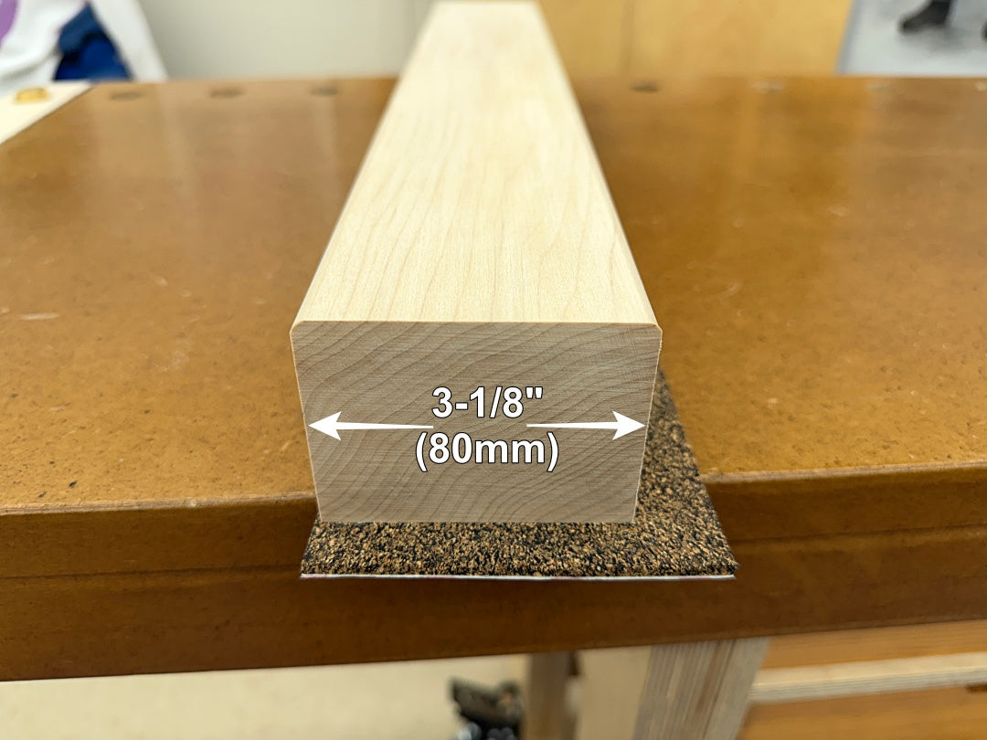 A hard maple vise jaw on a workbench with a dimension overlay indicating a width of 3-1/8 inches (80mm).