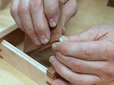 Rob Cosman fitting a dowel into the woodhinge groove he just cut